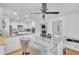 Bright kitchen features white cabinets, stainless steel appliances, granite countertops, and a modern glass table set at 2702 Moorings Pkwy, Snellville, GA 30039