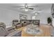 Comfortable living room featuring a large leather sectional sofa and stylish decor at 2702 Moorings Pkwy, Snellville, GA 30039