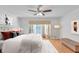 Relax in this main bedroom featuring a ceiling fan, natural light, and stylish decor at 2702 Moorings Pkwy, Snellville, GA 30039