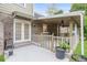 Spacious patio features brick accents, concrete flooring, a ceiling fan, and access to the backyard at 2702 Moorings Pkwy, Snellville, GA 30039
