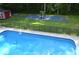 Large backyard with fenced-in pool, a shed and sport court, perfect for outdoor fun at 329 Kyles Cir, Hiram, GA 30141