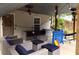 Covered patio with comfortable seating, string lights and a fan creating a relaxing outdoor space at 329 Kyles Cir, Hiram, GA 30141