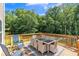 Outdoor deck featuring patio seating with a wooded backyard at 329 Kyles Cir, Hiram, GA 30141