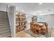 Living room featuring a dining table, shelves with games, and stairs at 329 Kyles Cir, Hiram, GA 30141