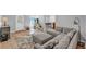 View of the living room with a sofa, game machine, and stylish decor at 329 Kyles Cir, Hiram, GA 30141