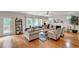 Open living room with hardwood floors, a fireplace, and ample natural light at 329 Kyles Cir, Hiram, GA 30141