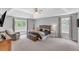 Spacious main bedroom with tray ceilings, neutral walls, carpet, and large windows for natural light at 329 Kyles Cir, Hiram, GA 30141