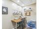 Functional office space with a sewing machine, cork board, desk, and shelving for organized work at 329 Kyles Cir, Hiram, GA 30141