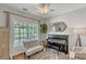 Sitting room with neutral-colored walls, an area rug, a bench, and a piano at 329 Kyles Cir, Hiram, GA 30141