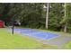 Backyard sport court with shed and mature trees at 329 Kyles Cir, Hiram, GA 30141