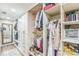 Organized walk-in closet with ample shelving, clothing racks, and a mirror for convenience at 329 Kyles Cir, Hiram, GA 30141