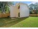 This home has a spacious backyard with a wood privacy fence and sliding glass doors for entertaining and relaxation at 510 Northridge Crossing Dr, Sandy Springs, GA 30350