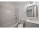 Bathroom showcasing a tub-shower combination, vanity with sink, and stylish mirror at 510 Northridge Crossing Dr, Sandy Springs, GA 30350