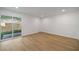 Bright bedroom featuring wood flooring and sliding door access to the exterior at 510 Northridge Crossing Dr, Sandy Springs, GA 30350