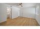 Spacious bedroom featuring light colored flooring, a ceiling fan and access to an ensuite bathroom at 510 Northridge Crossing Dr, Sandy Springs, GA 30350
