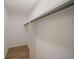 An empty walk-in closet featuring light-colored flooring and hanging rods at 510 Northridge Crossing Dr, Sandy Springs, GA 30350