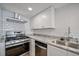 Updated kitchen features granite countertops and stainless steel appliances at 510 Northridge Crossing Dr, Sandy Springs, GA 30350