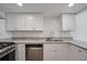 Updated kitchen features granite countertops and stainless steel appliances at 510 Northridge Crossing Dr, Sandy Springs, GA 30350