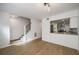 Bright, modern living room and open staircase, flowing into kitchen area at 510 Northridge Crossing Dr, Sandy Springs, GA 30350