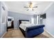 This bedroom features a large mirror, TV, and ceiling fan at 1850 Cotillion Dr # 4419, Atlanta, GA 30338