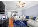 Inviting living room with hardwood floors, ceiling fan, and large sectional at 1850 Cotillion Dr # 4419, Atlanta, GA 30338