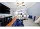 Cozy living room featuring hardwood floors, plush sectional, and decorative accents at 1850 Cotillion Dr # 4419, Atlanta, GA 30338