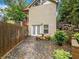 Private backyard patio area featuring stone seating and lush landscaping, perfect for relaxation at 2956 Springlake Dr, Buford, GA 30519