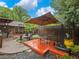 Backyard with outdoor kitchen, and shaded seating area provides a perfect spot for relaxation and entertainment at 2956 Springlake Dr, Buford, GA 30519