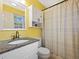 Bathroom featuring granite countertop, vanity, and a shower with blue and white curtain at 2956 Springlake Dr, Buford, GA 30519