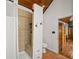 Bathroom with tiled shower, a toilet, and wood floors at 2956 Springlake Dr, Buford, GA 30519