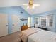 Cozy bedroom with natural light, neutral paint, and a classic wood bed frame at 2956 Springlake Dr, Buford, GA 30519