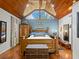 Nautical-themed bedroom with a wood-paneled ceiling, and a large triangular window at 2956 Springlake Dr, Buford, GA 30519