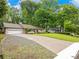Charming single-story home with a two-car garage and an expansive, well-manicured front yard at 2956 Springlake Dr, Buford, GA 30519