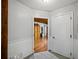 Hallway leading to a room with hardwood floors and a wood-paneled ceiling at 2956 Springlake Dr, Buford, GA 30519
