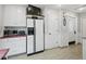 Practical kitchen layout with white cabinetry, essential appliances, and convenient access to a pantry at 2956 Springlake Dr, Buford, GA 30519