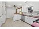 Efficient kitchen with white cabinetry, modern appliances, and an island with bar seating at 2956 Springlake Dr, Buford, GA 30519