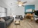 This living room showcases a cozy stone fireplace, soft gray sofas, and neutral color scheme at 2956 Springlake Dr, Buford, GA 30519