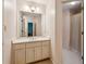 Bathroom featuring double sinks and a shower behind a partial wall at 4070 Ridgehurst Se Dr, Smyrna, GA 30080