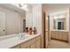 Bathroom featuring double sinks, cabinets and a mirror at 4070 Ridgehurst Se Dr, Smyrna, GA 30080