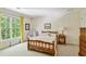 Bedroom with a bed, chair, window and chest of drawers at 4070 Ridgehurst Se Dr, Smyrna, GA 30080