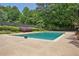 Community pool area surrounded by trees and a fence, perfect for enjoying outdoor activities and relaxing with neighbors at 4070 Ridgehurst Se Dr, Smyrna, GA 30080