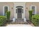 The front door features an ornate transom and is flanked by lion statues and manicured greenery at 4070 Ridgehurst Se Dr, Smyrna, GA 30080