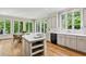 Bright eat-in kitchen featuring a central island and a breakfast nook overlooking the backyard at 4070 Ridgehurst Se Dr, Smyrna, GA 30080