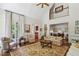 Open-concept living room with tall ceilings, elegant furnishings, and bright natural light at 4070 Ridgehurst Se Dr, Smyrna, GA 30080