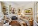 Cozy living room featuring a fireplace, built-in bookshelves, and lots of natural light at 4070 Ridgehurst Se Dr, Smyrna, GA 30080