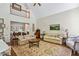 Spacious living room with high ceilings, hardwood floors, and a large decorative rug at 4070 Ridgehurst Se Dr, Smyrna, GA 30080