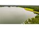 Scenic aerial shot of a tranquil lake with a dam and lush green landscape at 5200 Woodmont Dr, Villa Rica, GA 30180