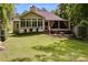 This house features a spacious backyard with a shed and screened-in porch at 5200 Woodmont Dr, Villa Rica, GA 30180