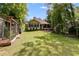 Beautiful backyard with a shed and screened-in porch, perfect for outdoor enjoyment at 5200 Woodmont Dr, Villa Rica, GA 30180