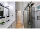 Beautiful bathroom with marble countertops, shiplap accent wall, and glass-enclosed shower at 5200 Woodmont Dr, Villa Rica, GA 30180